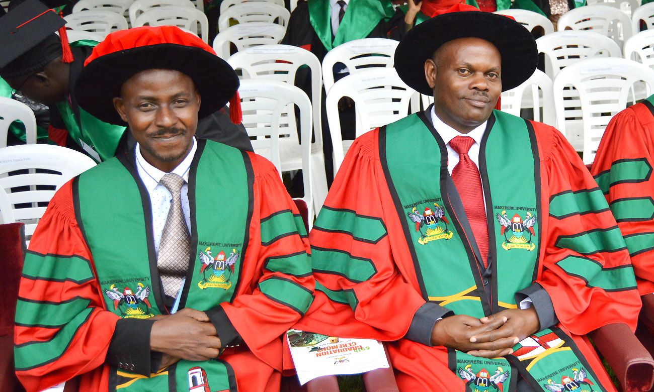 Dr. Isaac Mugume (Left) and Dr. Francis Mugizi (Right) smile for the camera Day1 of the 69th Graduation Ceremony, 15th January 2019, Freedom Square, Makerere University, Kampala Uganda