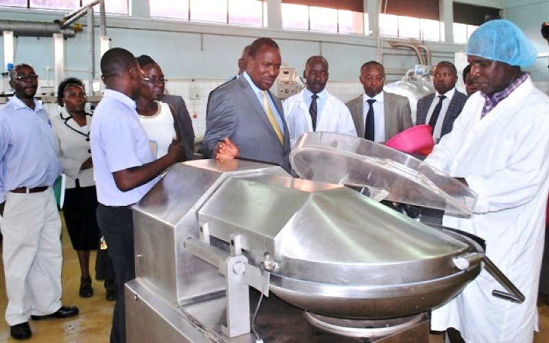 The Minister of Science, Technology, and Innovation, Hon. Dr. Elioda Tumwesigye (Centre), accompanied by Makerere and Ministry staff inspects the meat processing line at FTBIC, CAES, 4th April 2017, Makerere University Kampala Uganda