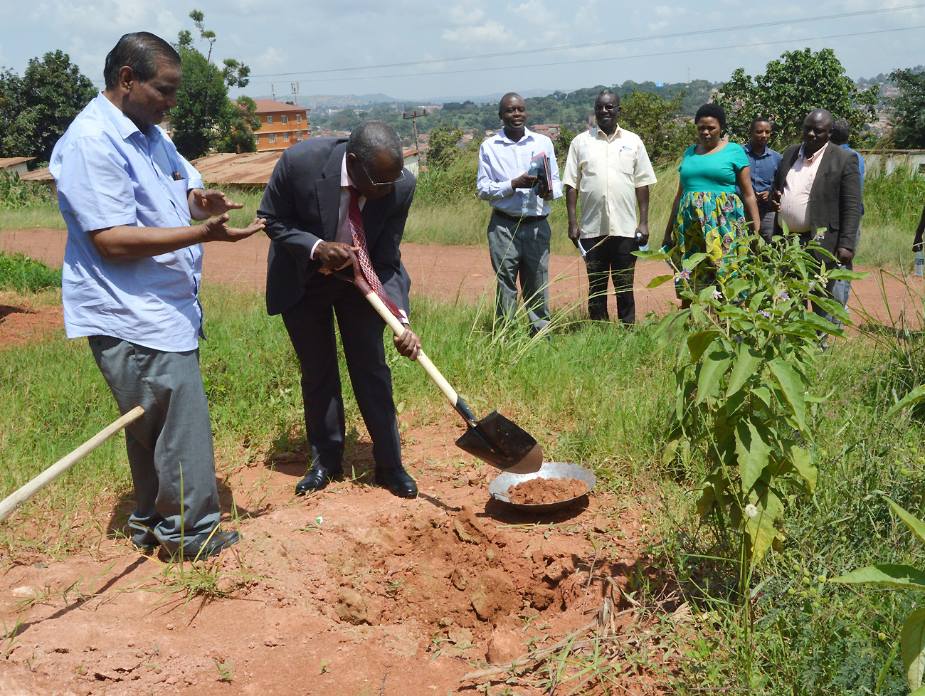 Eng. Murali Krishna (Left) applauds as Principal CAES, Prof. Bernard Bashaasha (2nd Left) breaks ground at the FTBIC Phase II site on 5th July 2019, Makerere University, Kampala Uganda