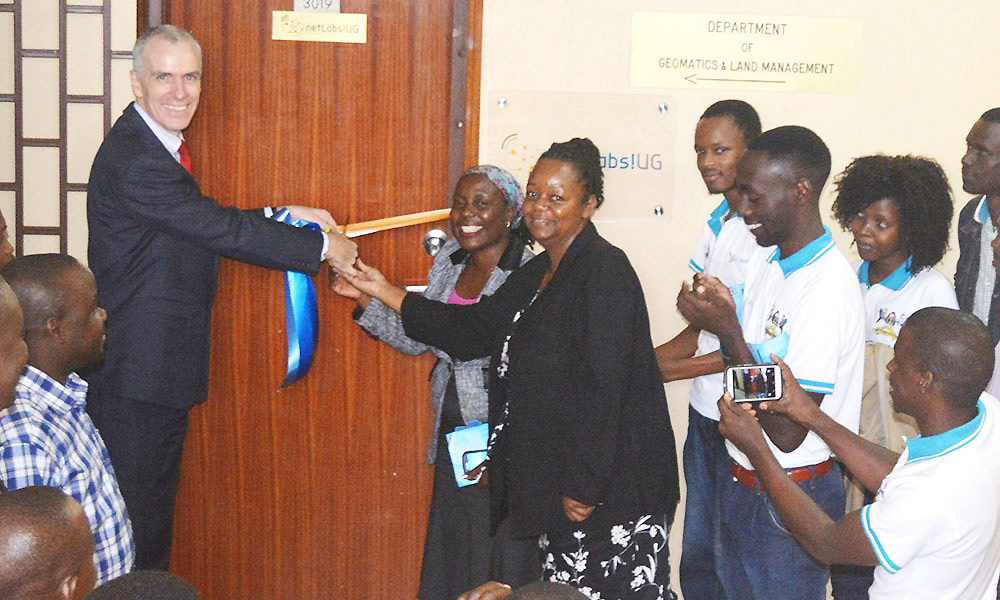 The Ambassador of Ireland to Uganda, H.E Donal Cronin (Left) assisted by Deputy Principal CEDAT, Dr. Venny Nakazibwe and Eng. Dr. Dorothy Okello launches the netLabs!UG project space on March 9, 2017 at CEDAT, Makerere University, Kampala Uganda