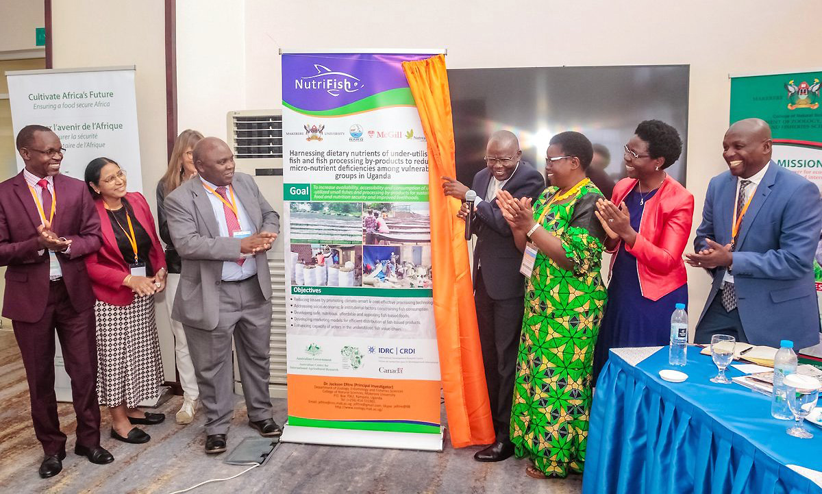 The Principal CAES, Prof. Bernard Bashaasha (holding microphone) flanked by other officials launches the CAD2.7million NutriFish collaborative project on 27th June 2019, Kampala Uganda.
