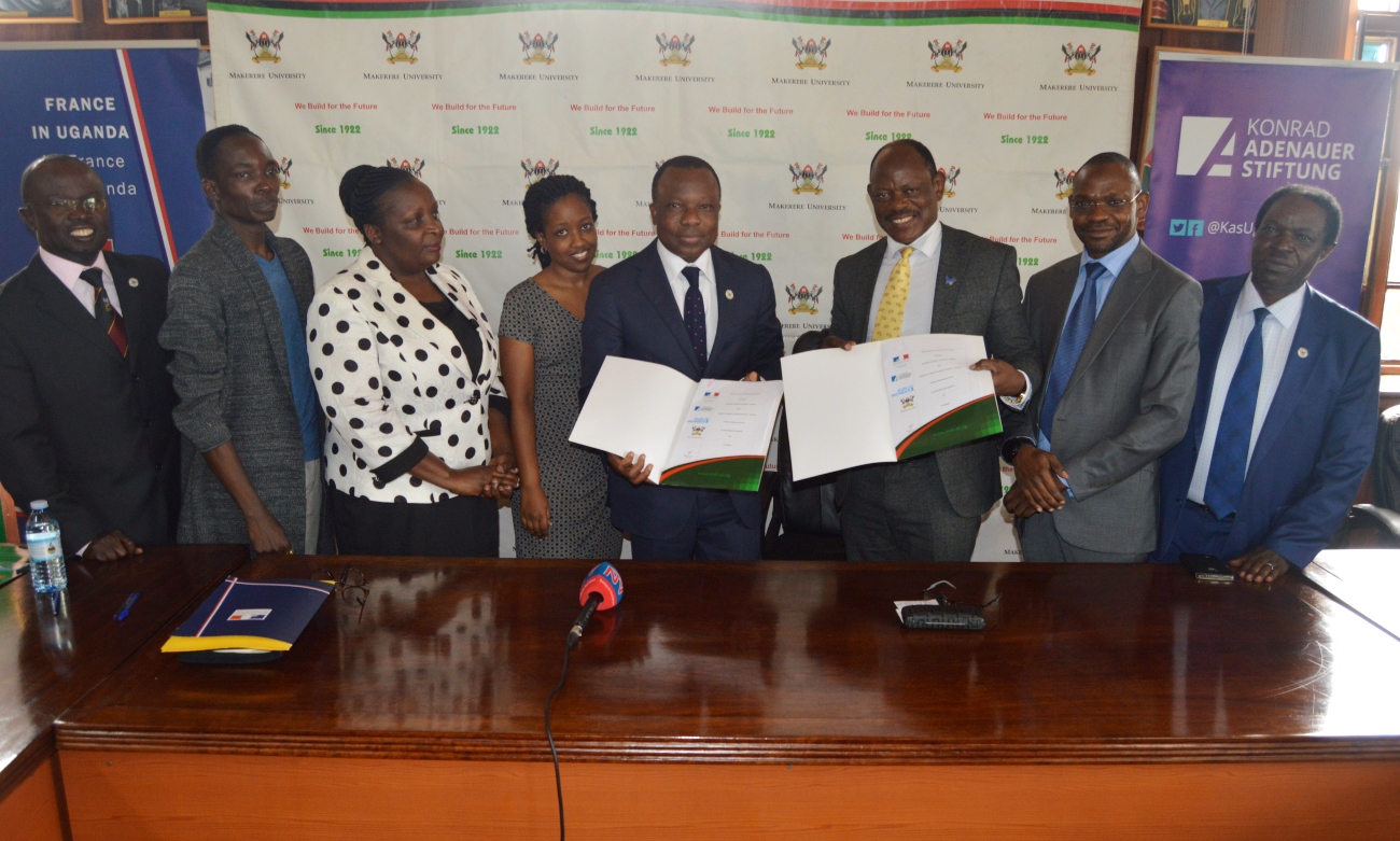 Ambassador of France to Uganda H.E Jules-Armand Aniambossou (4th R), Vice Chancellor, Prof. Barnabas Nawangwe (3rd R) with R-L: DVCFA-Prof. William Bazeyo, DVCAA-Dr. Umar Kakumba, Ms. Rhona Rugambwa-KAS, Ms. Agrippiner Nandego-UN Women, Mr. Gerald Odil- Alliance Francaise and Dr. Muhammad Kiggundu Musoke at the MoU signing, 31st July 2019, Makerere University, Kampala Uganda