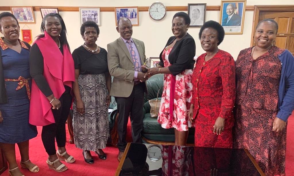 The Vice Chancellor, Prof. Barnabas Nawangwe (Centre) receives an award from HERS-EA Coordinator, Ms. Naomi Lumutenga (3rd Right) on 12th July 2019, Makerere University, Kampala Uganda