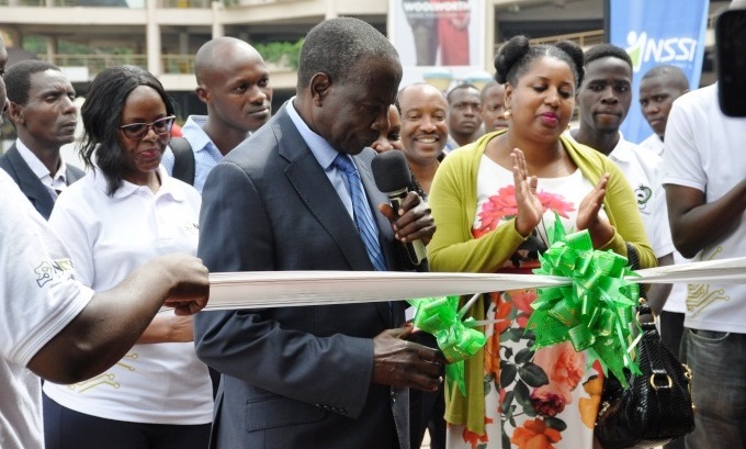 The Minister of Finance, Planning and Economic Development, Hon. Matia Kasaija cuts the tape to mark the official opening of the NITA-U eGovernment Excellence Expo on 20th June 2019, Garden city Rooftop, Kampala Uganda. Image:RAN