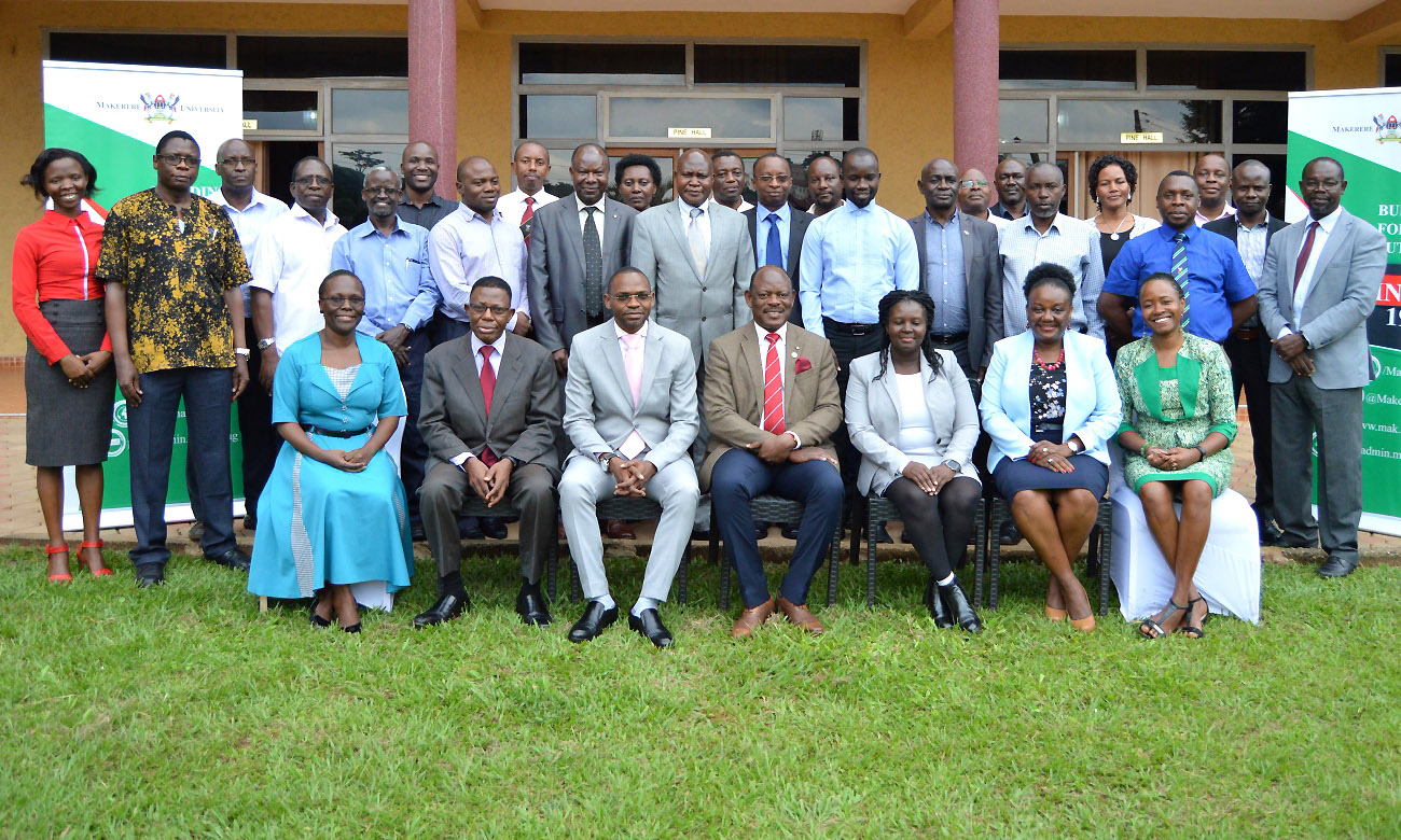(Seated Left to Right): Head of Performing Arts and Film Dr. S.Nannyonga Tamusuza, Director of Research and Graduate Training Prof. Buyinza Mukadasi, Deputy Vice Chancellor AA Dr.Umar Kakumba, Vice Chancellor Prof. Barnabas Nawangwe, Ag.Head of Medical Microbiology Dr. Beatrice Achan, Dean School of Public Health Dr. Rhoda Wanyenze, Dean School of Women and Gender Studies Dr. Sarah Ssali join other Heads of Departments at the Workshop, Friday 9th August 2019 at Grand Global Hotel