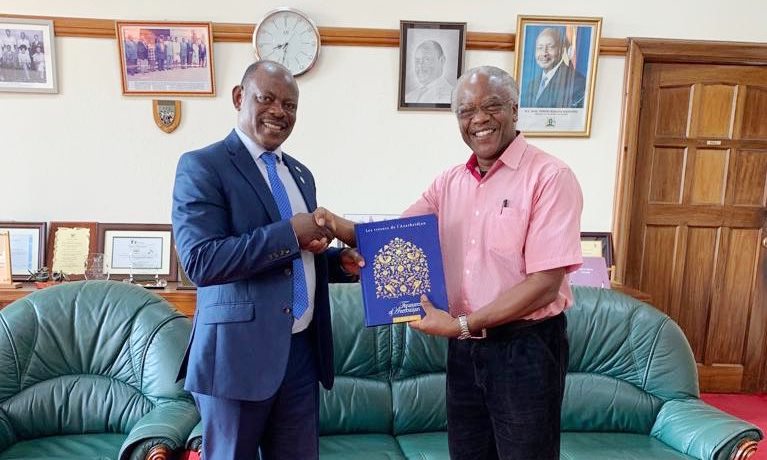 The Vice Chancellor, Prof. Barnabas Nawangwe (Left) receives the UNESCO publication on the heritage of Azerbaijan from Dr. Allan Birabi on 12th August 2019, Makerere University, Kampala Uganda