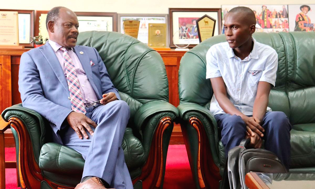 The Vice Chancellor, Prof. Barnabas Nawangwe (Left) chats with First Year Student, Mr. Ssubi Henry Francis in his office on 8th August 2019, Makerere University, Kampala Uganda