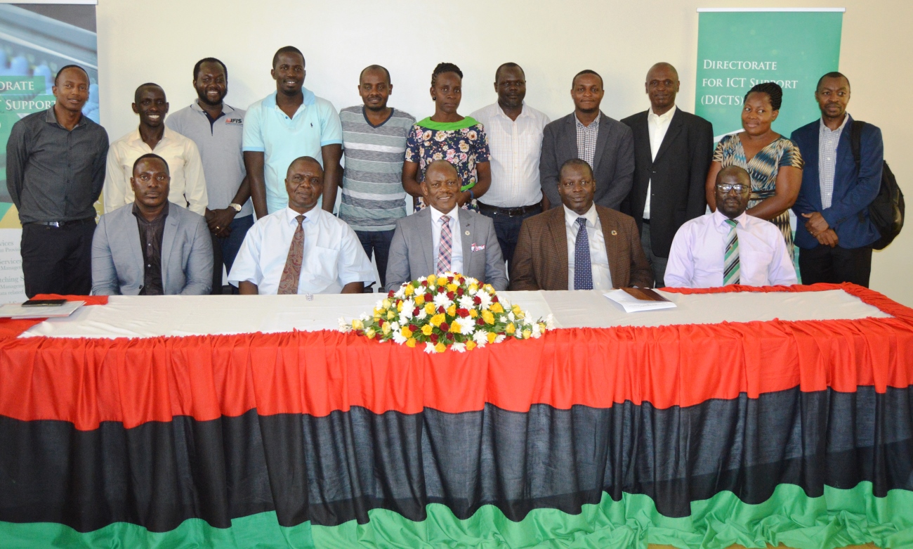 Seated: The Vice Chancellor, Prof. Barnabas Nawangwe (Centre) with L-R: Director DICTS-Mr. Samuel Mugabi, Dean SCIT-Dr. Gilbert Maiga, Principal CoCIS-Prof. Tonny Oyana and Deputy Principal CEES-Dr. Paul Muyinda Birevu with DICTS Staff (Standing) after the launch of MAKAIR-Makerere University’s Wireless Local Area Network, on 23rd March 2019, Third Level - CEDAT New Building, Kampala Uganda.