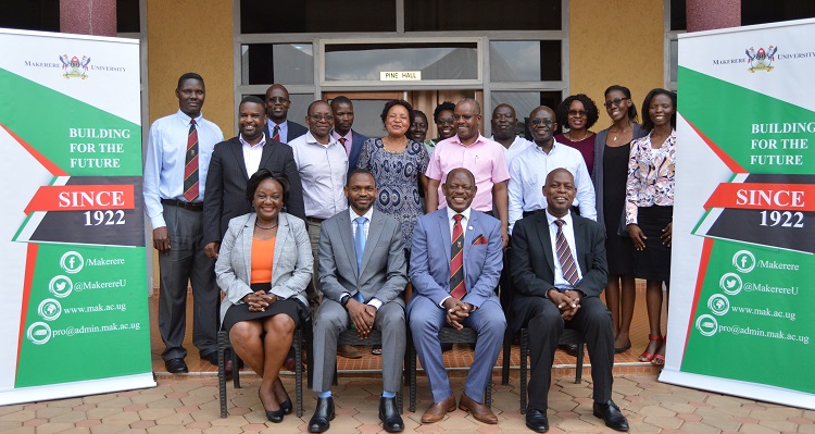(Seated Left to Right): Dean School of Public Health Dr. Rhoda Wanyenze, Deputy Vice Chancellor AA Dr.Umar Kakumba, Vice Chancellor Prof. Barnabas Nawangwe, and Director Quality Assurance Dr. Vincent Ssembatya , posing for a photo with the Heads of Department from the College of Health Sciences, Friday 30th August 2019 at Grand Global Hotel.