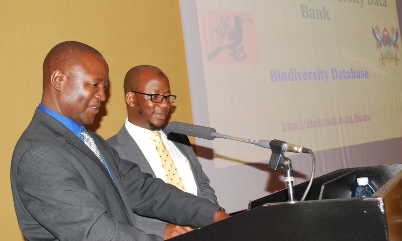 The Acting Commissioner Biodiversity in the Ministry of Tourism, Wildlife and Antiquities, Dr. Akankwasa Barirega (Right) assisted by Dr. Daniel Waiswa (Left) launches the Online National Biodiversity Data Bank (NBDB) on Thursday, 5th September 2019 at Speke Resort Munyonyo, Kampala Uganda.