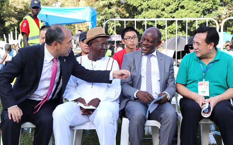 The Chinese Ambassador to Uganda-H.E. Zheng ZhuQiang (L) introduces one of the leaders of the Shaanxi Provincial Acrobatic Art Troupe (R) to the Minister of Tourism, Wildlife and Antiquities-Hon. Ephraim Kamuntu (2nd L) and the Vice Chancellor-Prof. Barnabas Nawangwe (2nd R) during the Chinese New Year Acrobatic Show, 26th January 2019, Freedom Square, Makerere University, Kampala Uganda