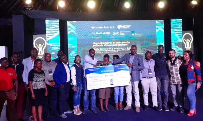 Teheca Limited poses with a dummy cheque shortly after winning the Seedstars Kampala Pitch Competition on 18th October 2019 as part of the Kampala Innovation Week, Kololo Independence Grounds, Kampala Uganda