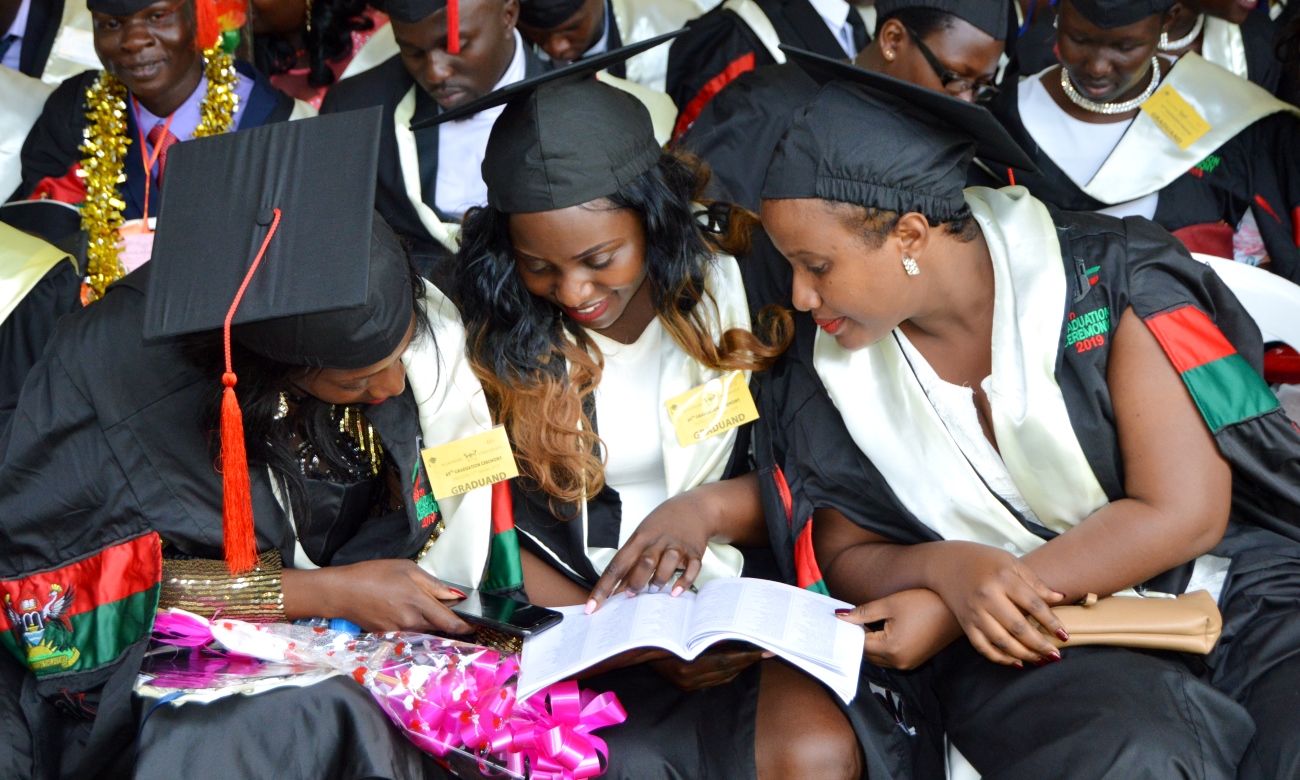 Female Graduands from MUBS follow the proceedings on Day 3 of the 69th Graduation Ceremony on 17th January 2019, Freedom Square, Makerere University, Kampala Uganda