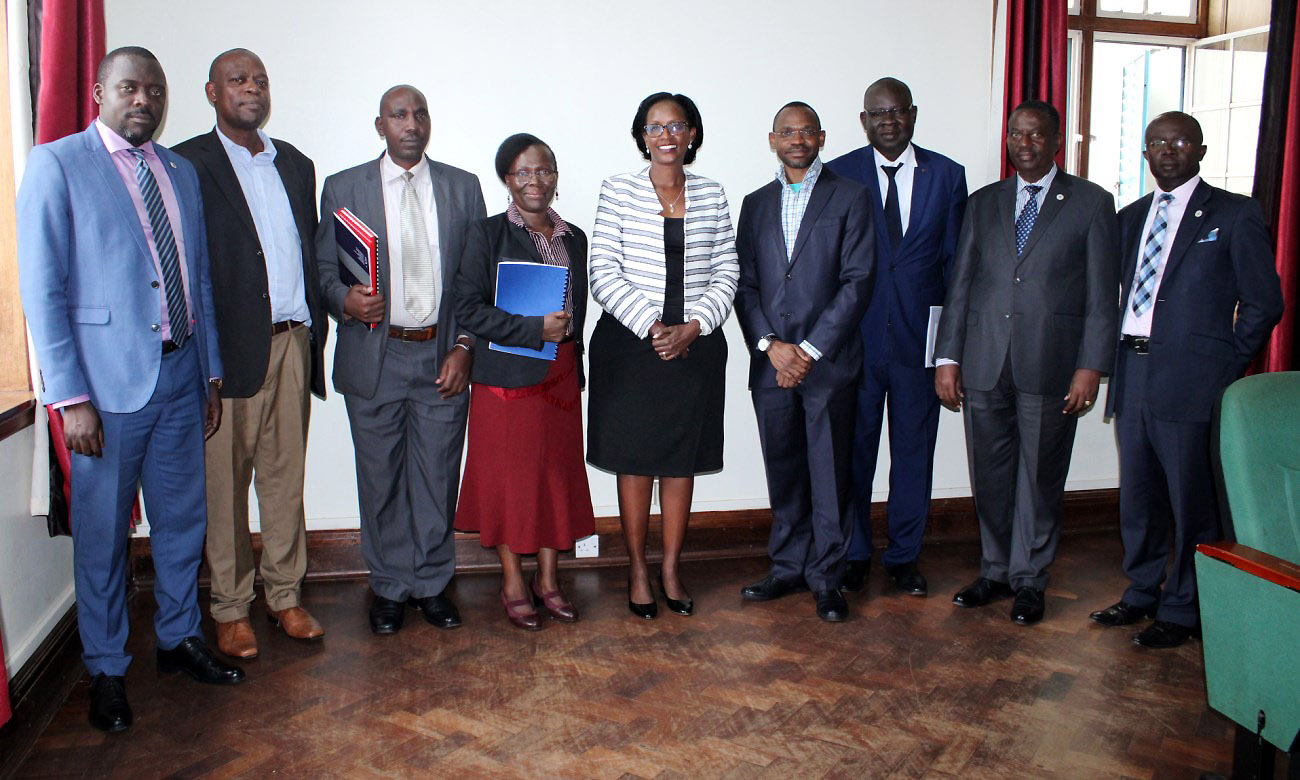 The Chair Council-Mrs. Lorna Magara (Centre) with L-R: Mr. Yusuf Kiranda, Dr. Vincent Ssembatya, Mr. Jackson Byamukama, Dr. Sylvia Nannyonga-Tamusuza, DVCAA-Dr. Umar Kakumba, Dr. Akileng Godfrey, Mr. Cyriaco Kabagambe and Dr. Muhammad Kiggundu Musoke after the swearing in ceremony, 1st November 2019, Senior Common Room, Main Building, Makerere University, Kampala Uganda