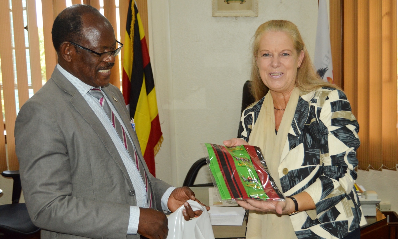 Director of the DAAD Regional Office for Africa, Ms. Beate Schindler-Kovats (Right) shows of the Mak Scarf received from Vice Chancellor-Prof. Barnabas Nawangwe (Left) during her visit on 28th November 2019, Makerere University, Kampala Uganda