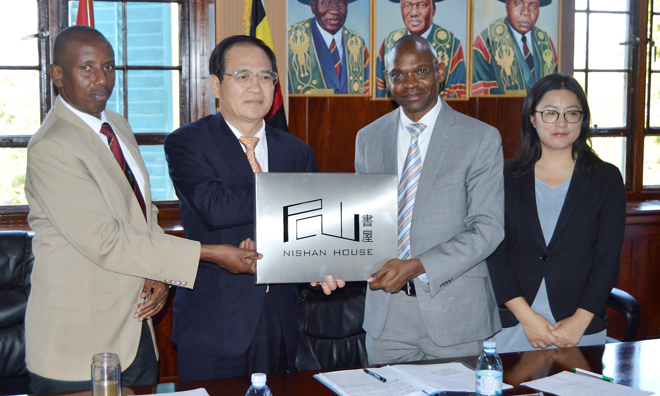 The DVCAA-Dr. Umar Kakumba (2nd Right) flanked by Head, African Languages-Dr. Gilbert Gumoshabe (Left) and Director, Confucius Institute-Prof. Xia Zhuoqiong (Right) receives the Nishan House Plaque from Honourable Fu Zhifang (2nd Left) on 11th November 2019, Council Room, Makerere University, Kampala Uganda.