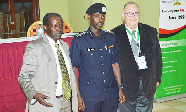 Deputy Inspector General of Police Maj. General Sabiiti Muzeyi flanked by Prof. William Bazeyo(Left) and Prof. Dr. Mete Korkut Gulmen (Right) from Cukurova University (CU) at the Opening Ceremony of a three-day symposium in Kampala.