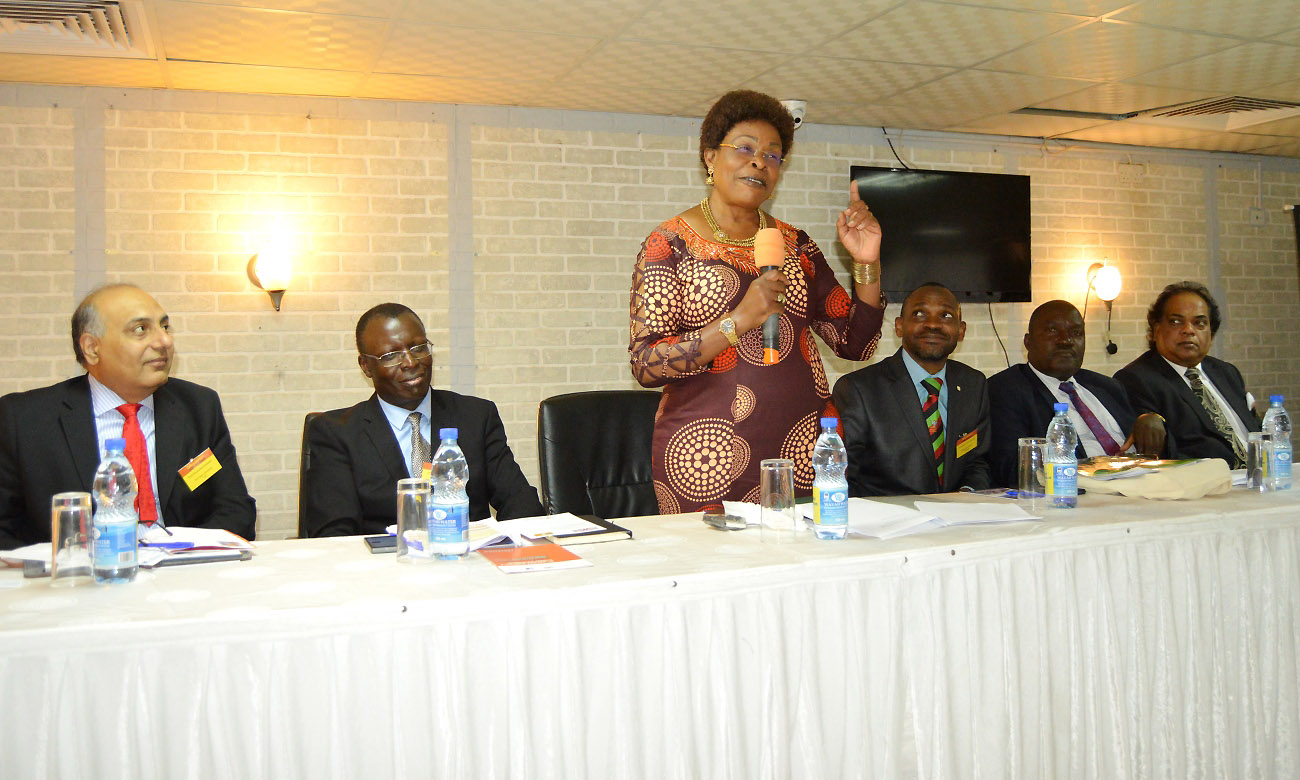 Hon. Beti Kamya (3rd Left) gives her address as L-R: Prof. Devendra Kodwani, Dr. Charles Mbalyohere, DVCAA-Dr. Umar Kakumba, Prof. Fred Masagazi Masaazi and Dr. Kaviraj Sharma Sukon listen during the 1st Open Impact Conference, 13th December 2019, Hotel Africana, Kampala Uganda.