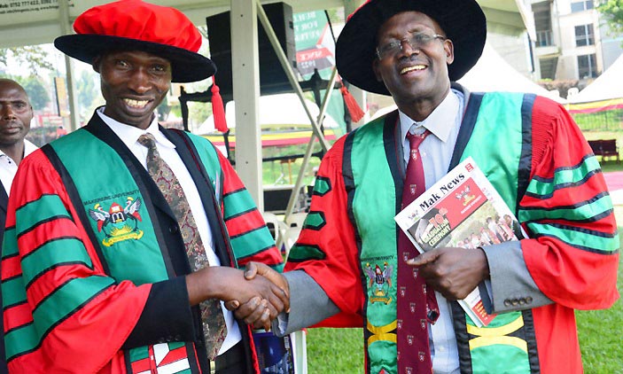 Assoc. Prof. Christopher Garimoi (right), congratulates Dr. Godfrey Bwire (Left) after he was conferred upon his PhD during Day 1 of the 70th Graduation Ceremony, 14th January 2020, Makerere University, Kampala Uganda. Photo Credit: New Vision