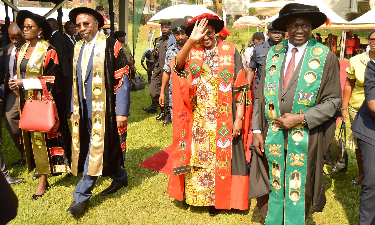 The First Lady and Minister of Education-Hon. Janet Museveni (2nd Right) flanked by the Prime Minister-Rt. Hon. Dr. Ruhakana Rugunda (2nd Left), Chairperson Council-Mrs. Lorna Magara (Left) and Vice Chairperson Council-Rt. Hon. Daniel Fred Kidega (Right) waves to graduands during Day 1 of the 70th Graduation Ceremony, 14th January 2020, Makerere University, Kampala Uganda.