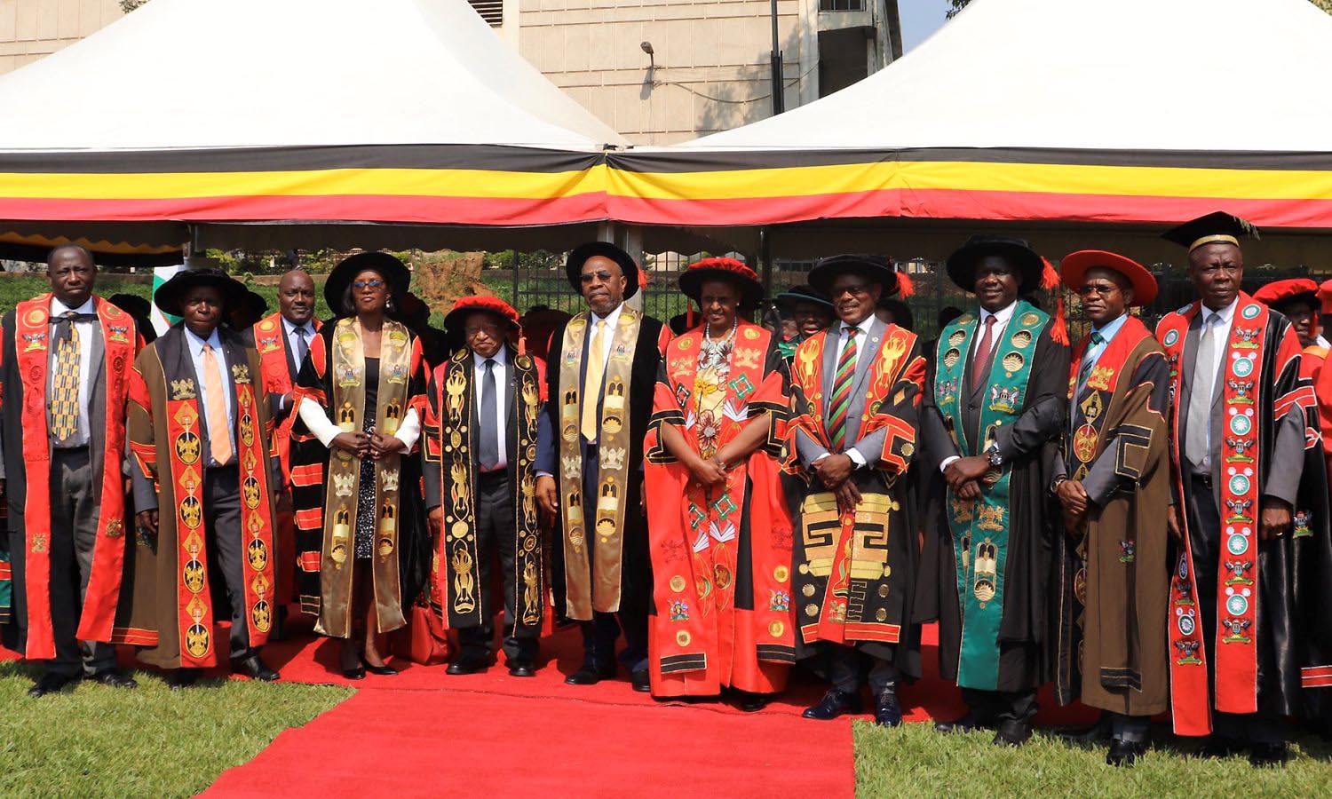 The Prime Minister-Rt. Hon. Dr. Ruhakana Rugunda (5th L) together with the First Lady and Minister of Education and Sports-Hon. Janet Museveni (5th R) pose for a photo with the Chancellor-Prof. Ezra Suruma (4th L), Chairperson Council-Mrs. Lorna Magara (3rd L), Vice Chairperson Council-Rt. Hon. Daniel Fred Kidega (3rd R), Vice Chancellor-Prof. Barnabas Nawangwe (4th R), DVCAA-Dr. Umar Kakumba (2nd R), DVCFA-Prof. William Bazeyo (2nd L), Academic Registrar-Mr. Alfred Masikye Namoah (R), Principal CHS-Prof. C