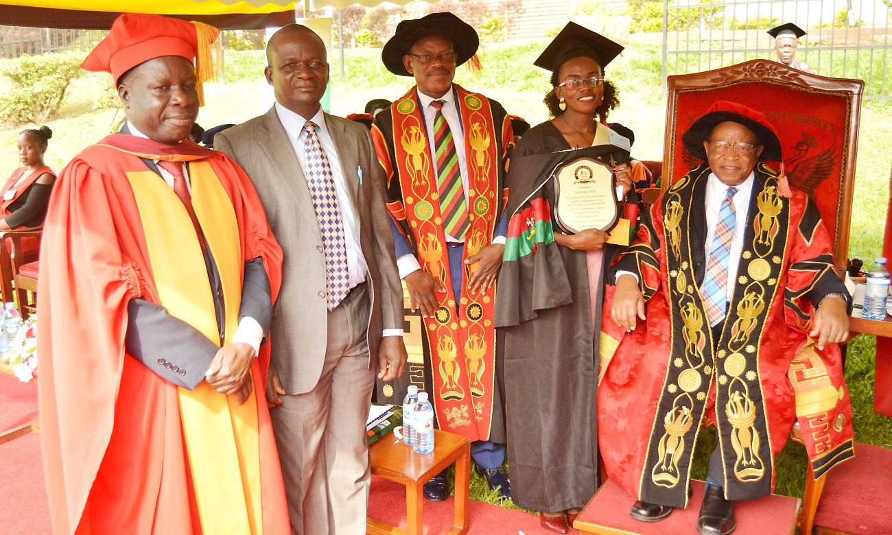 R-L: The Chancellor-Prof. Ezra Suruma, Best Overall Student-Ms. Namukose Rita, Vice Chancellor-Prof. Barnabas Nawangwe, Ms. Namukose's Father and Chairperson Convocation-Dr. Tanga Odoi at Day 3 of the 70th Graduation Ceremony, 16th January 2020, Makerere University, Kampala Uganda.