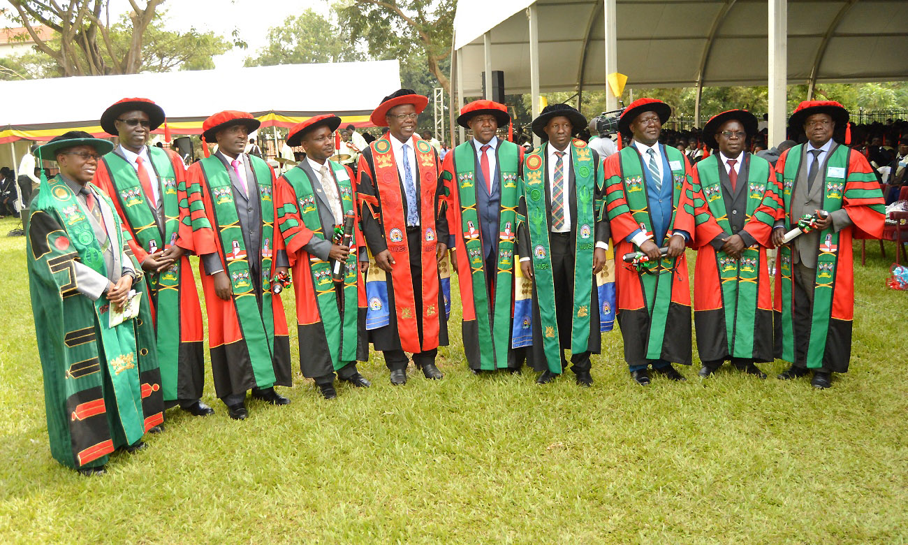 The Principal MUBS-Prof. Waswa Balunywa (5th L), Deputy Principal-Dr. Moses Muhwezi (4th R), Director DRGT-Prof. Buyinza Mukadasi (L) with MUBS PhD Graduands on Day 3 of the 70th Graduation Ceremony, 16th January 2020, Makerere University, Kampala Uganda.