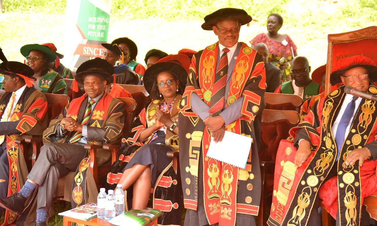 The Vice Chancellor-Prof. Barnabas Nawangwe stands to acknowledge PAF Students as they sang Happy Birthday to him as R-L: Chancellor-Prof. Ezra Suruma, Chairperson Council-Mrs. Lorna Magara, DVCAA-Dr. Umar Kakumba and DVCFA-Prof. William Bazeyo listen during Day 4 of the 70th Graduation Ceremony, 17th January 2020, Makerere University, Kampala Uganda.