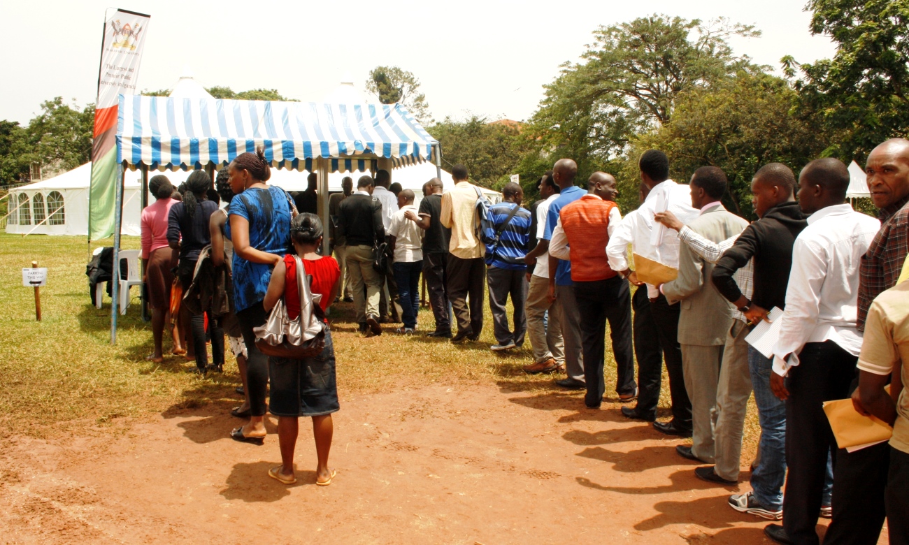 Staff, Students and Members of the Public queue to access the Freedom Square on one of the days during the BBC Science Festival hosted by Makerere University from 24th to 29th March 2013, Kampala Uganda. Makerere attracts a thousands of visitors both from within and outside Uganda every year.
