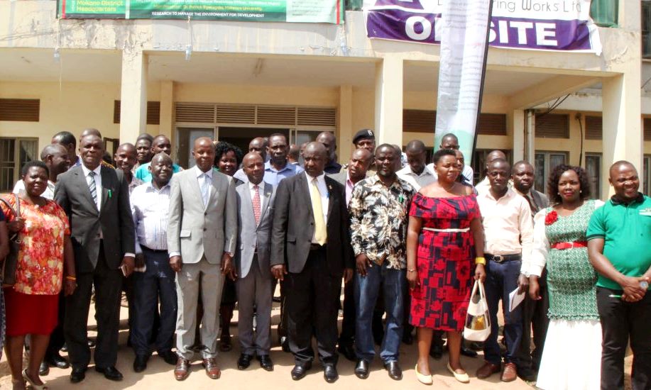 Mukono District Resident District Commissioner (RDC) Fred Bamwine (Centre Black Suit) with the Director, EfD-Mak Centre-Dr. Edward Bbaale (4th Left), Mak Staff and Councilors during the dialogue held at the District Administrative Hall on 20th February 2020, Mukono, Uganda.