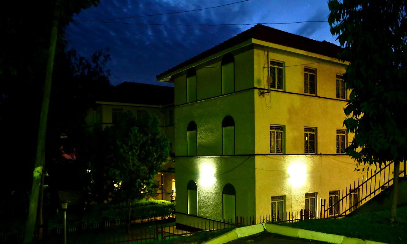 The School of Forestry, Environmental and Geographical Sciences (SFEGS) as seen at dusk from the St. Augustine Chapel parking lot, Makerere University, Kampala Uganda. Date taken: 3rd September 2017.