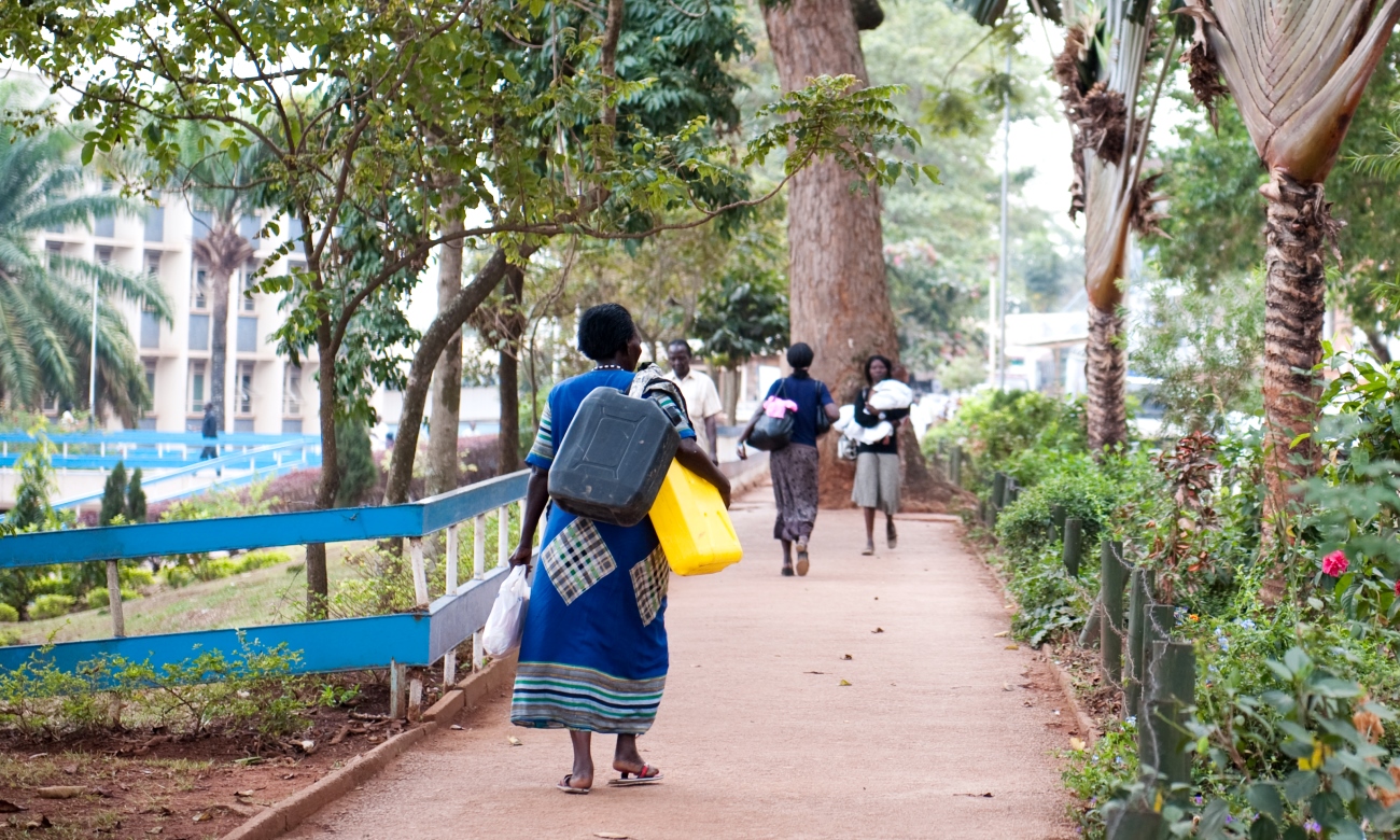 Ladies and a gentleman make their way to and from the Mulago Hospital Complex, Kampala Uganda. Date Taken: 13th August 2010