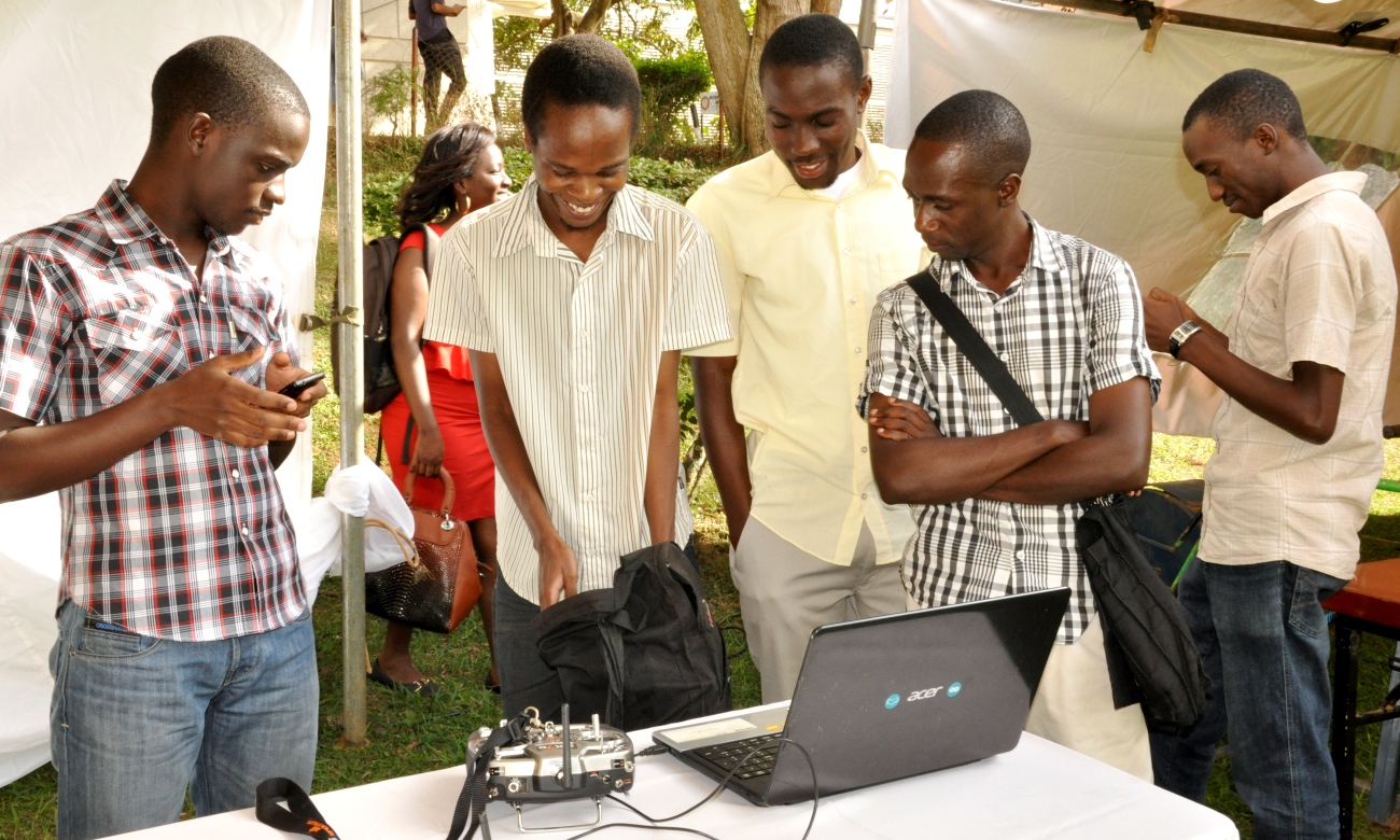 Students from the College of Engineering, Design, Art and Technology prepare to showcase their innovations as part of the Presidential Initiative for Science and Technology Stakeholders Forum on 31st July 2014, Makerere University, Kampala Uganda.