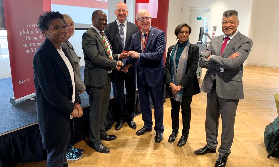 The Vice Chancellor-Prof. Barnabas Nawangwe (3rd Left) receives a souvenir Prof. Ed Byrne, President and Principal of KCL as other members of the PluS Alliance witness on 5th February 2020, KCL, London UK. Left is Prof. Funmi Olonisakin, Vice-President and Vice-Principal International of KCL.