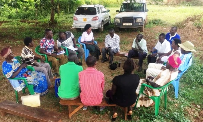 Dr. Gabriel Karubanga (3rd Left) the article author and Post-Doctoral Fellow at Department of Extension and Innovation Studies, College of Agricultural and Environmental Sciences, Makerere University, Kampala Uganda engages in a Focus Group Discussion. Photo Credit: RUFORUM