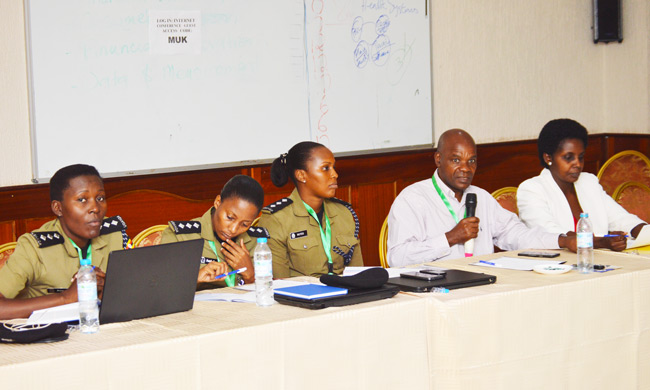 Principal of College of Natural Sciences - Prof. Joseph Mugisha (Second Right) and Deputy Academic Registrar Ms Patience Mushengyezi on his right together with representative from Uganda Police at the workshop.