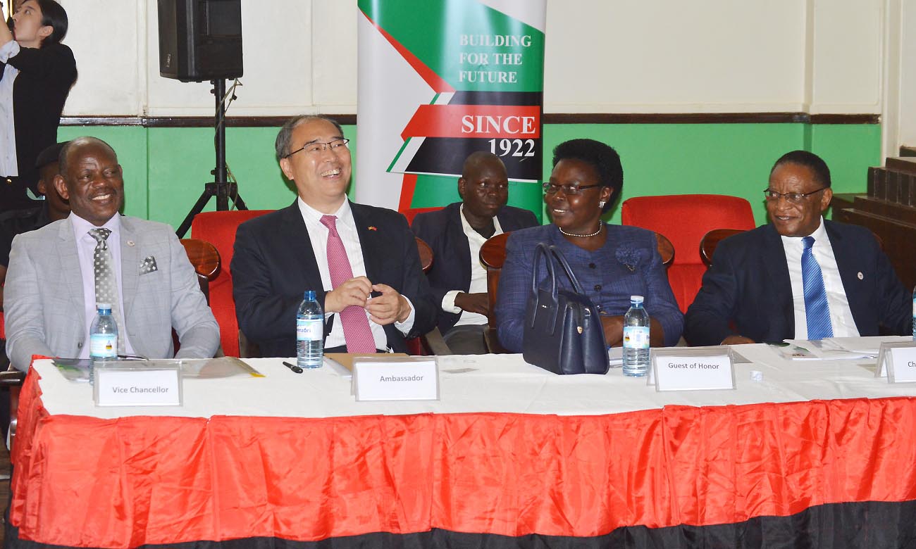 The Guest of Honour-Hon. Grace Freedom Kwiyucwiny (2nd Right), Ambassador of the People’s Republic of China to Uganda-H.E. Zheng Zhuqiang (2nd Left), Chancellor-Prof. Ezra Suruma (Right) and Vice Chancellor-Prof. Barnabas Nawangwe (Left) share a light moment during the Belt and Road Initiative Public Lecture, 27th February 2020, Makerere University, Kampala Uganda.