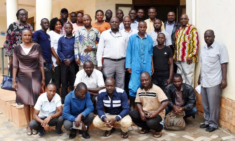 Participants pose for a group photo after the consultative meeting with the Project PI-Assoc. Prof. Donald Rugira Kugonza (2nd Row Standing-Right), Dr. Anena Catherine Pauline (Left), Ms. Lydia Magala (2nd Left), Mr. Robert Natumanya (2nd Row Standing-3rd Right) and Dr. Gideon Nadiope (3rd Row Standing-2nd Right) pm 18th March 2020, Wakiso District Headquarters, Uganda.