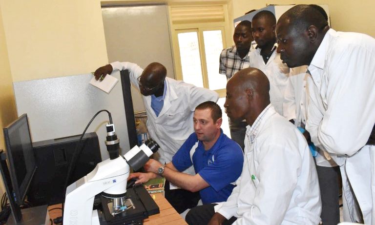 Mr. Sepp Weigert, Technical Product Specialist, Minitube Software Company, Winscosin USA (in blue) takes Staff and Students through training on the use of the Spermvision after its installation on 25th February 2020. Right is Dr. Sadhat Walusimbi, Physiologist and In-charge of the Central Biotechnology Laboratory, CAES, Makerere University, Kampala Uganda.