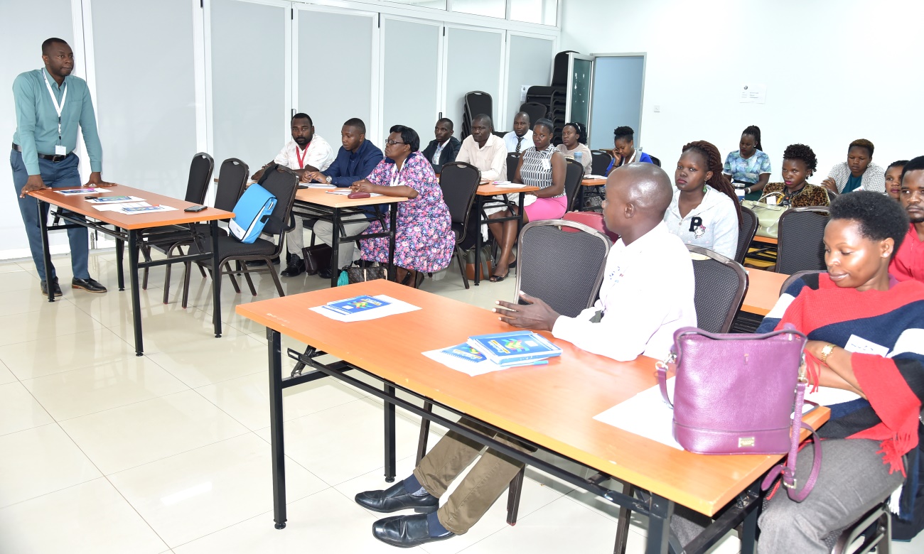 The Head, IDI Global Health Security Programme (GHSP)-Dr. Mohammed Lamorde (Left) listens to feedback from VMMCs during the three-day training in March 2020, IDI-McKinnell Knowledge Centre, Makerere University, Kampala Uganda.