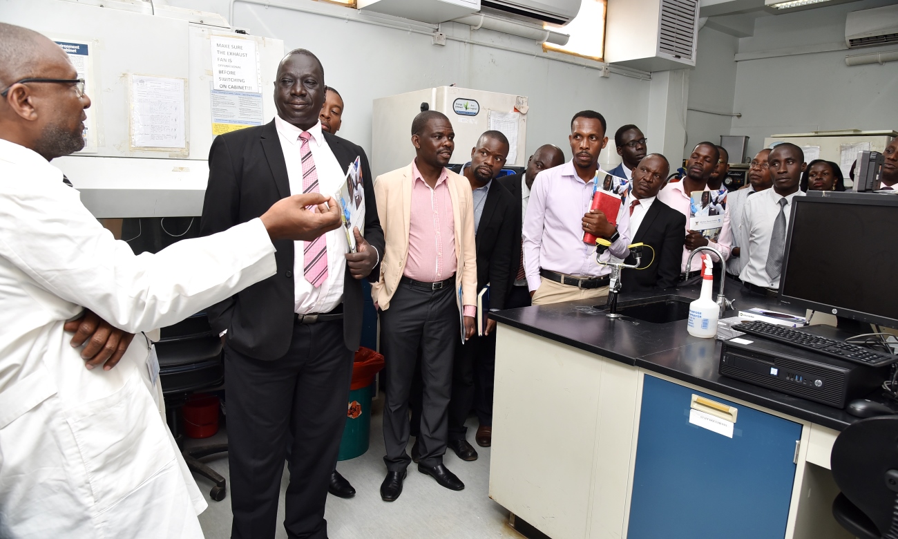 Guests led by Prof. Charles George Okiria, Chairperson of the Allied Health Professionals Council (AHPC) Uganda (2nd Left) tour one of the facilities of the Core Lab under the Laboratory Programme at the Infectious Diseases Institute (IDI), Makerere University in Mulago during the Open Day on 13th February 2020.