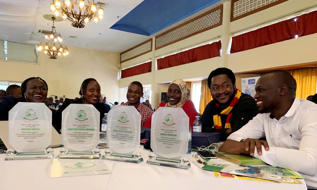 The Team from the Infectious Diseases Institute (IDI), Makerere University poses with Institutional and personal awards during the launch of the MedSafety App, 26th February 2020, Golf Course Hotel, Kampala, Uganda.