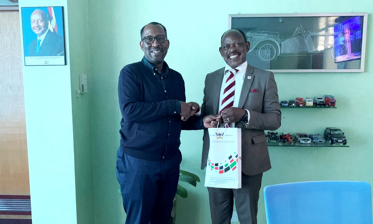 The Vice Chancellor-Prof. Barnabas Nawangwe (Right) hands over an assortment of Makerere University souvenirs to the MD and CEO NSSF-Mr. Richard Byarugaba (Left) after the two held discussions on 13th March 2020, Kampala Uganda.