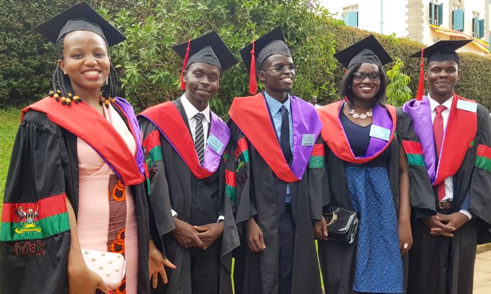 Pioneer Graduands of the Bachelor of Science in Optometry pose for a group photo shortly after their conferment on 15th January 2019 during the First Session of the 69th Graduation Ceremony, Makerere University, Kampala Uganda. Photo credit: Brien Holden Vision Institute