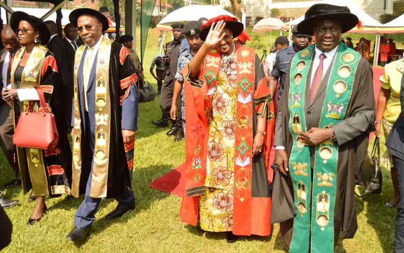 The First Lady and Minister of Education-Hon. Janet Museveni (2nd Right) flanked by the Prime Minister-Rt. Hon. Dr. Ruhakana Rugunda (2nd Left), Chairperson Council-Mrs. Lorna Magara (Left) and Vice Chairperson Council-Rt. Hon. Daniel Fred Kidega (Right) waves to graduands during Day 1 of the 70th Graduation Ceremony, 14th January 2020, Makerere University, Kampala Uganda.
