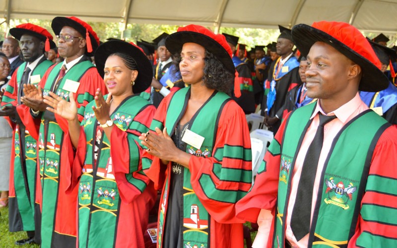 R-L: PhD Graduands; Mr. MASABO Emmanuel, Ms. NAKIBUULE Rose, Ms. NINA Olivia, Mr. OMODA-ONYAIT Godfrey & Mr. YAJJ Nuol Aywel Madut on Day 2 of the 70th Graduation Ceremony, 15th January 2020, Makerere University, Kampala Uganda.