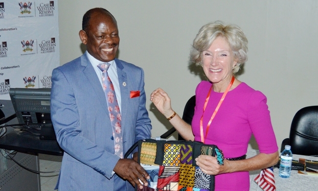 Prof. Barnabas Nawangwe (Left) presents HE. Barbara R. Snyder (Right) with a souvenir bag during the celebrations marking 30 years of collaboration between MakCHS and CWRU on 25th March 2019, Makerere University, Mulago Campus, Kampala Uganda.