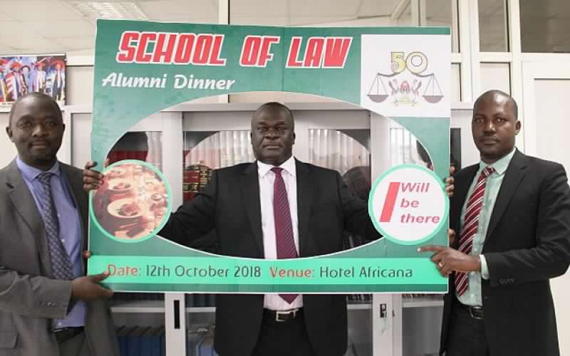 The Deputy Chief Justice of Uganda-Justice Alfonse Owiny Dollo (C) flanked by the Principal-Dr. Christopher Mbazira (R) and a member of the Organising Committee shows his support for the upcoming Law@50 Celebrations on 11th September 2018 at his Office, Kampala Uganda