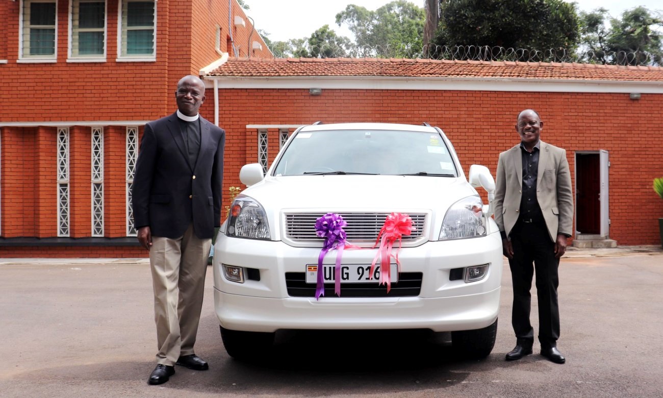 The Vice Chancellor-Prof. Barnabas Nawangwe (Right) and St. Francis Chaplain-Rev. Can. Onesimus Asiimwe (Left) after the car handover ceremony on 23rd May 2020, Vice Chancellor's Lodge, Makerere University, Kampala Uganda.