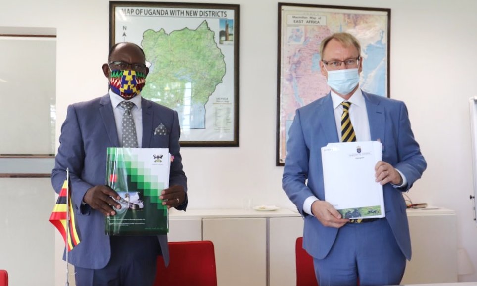 H.E. Per Lindgärde (Right) and Prof. Barnabas Nawangwe (Left) show off the signed the Specific Agreement to extend support from the Swedish Government to Ugandan Public Universities for research on 14th May 2020, Kampala, Uganda.